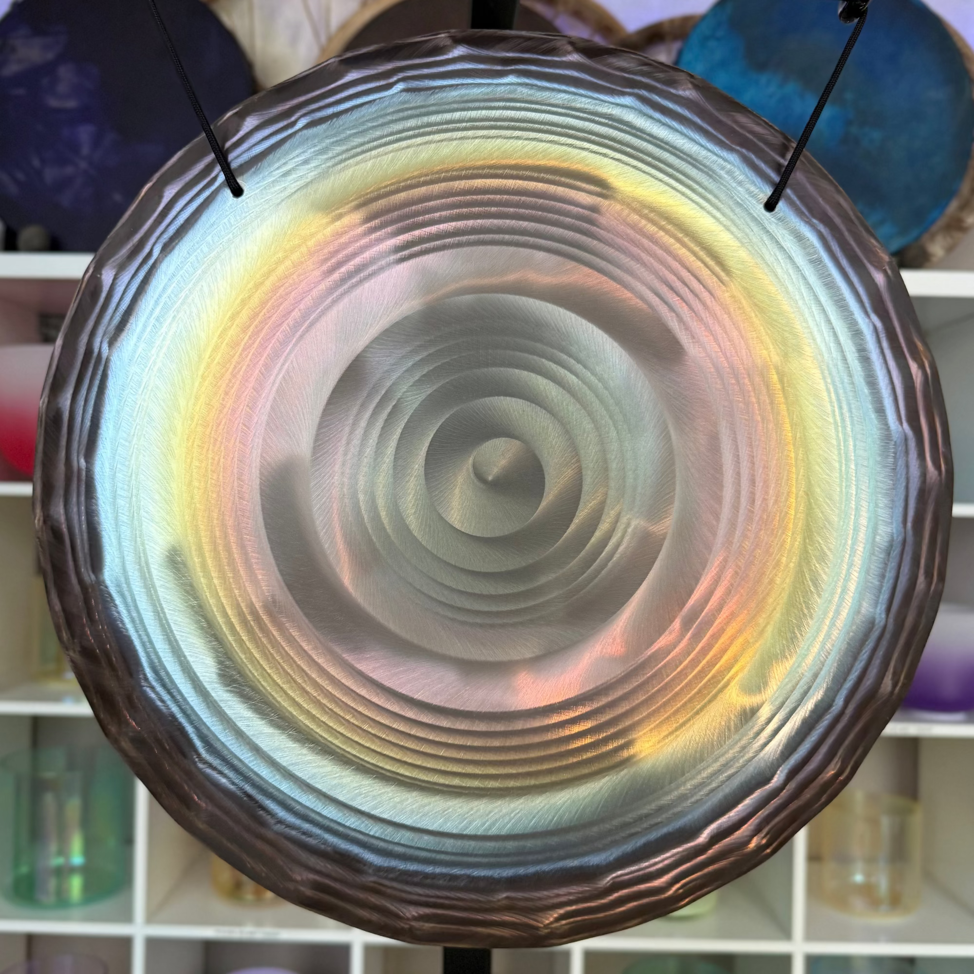Decorative circular object with concentric patterns on a blurred background
