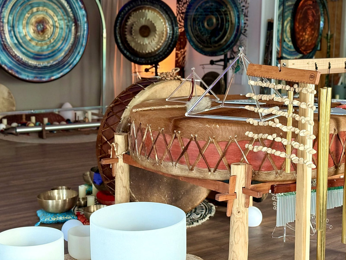 Gongs, a drum and crystal bowls in the Revival Harmony studio by day